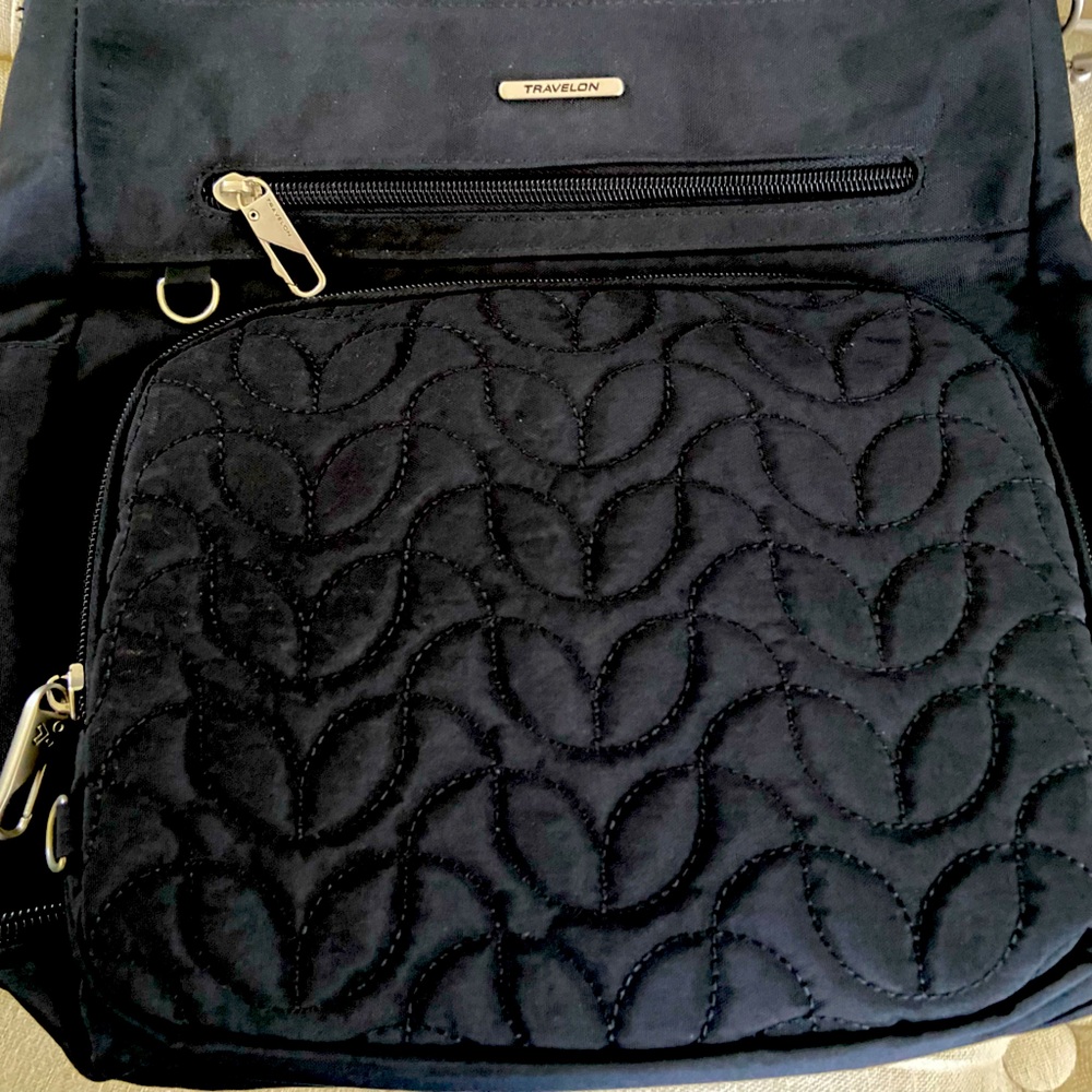 Travelon crossbody anti theft travel purse.